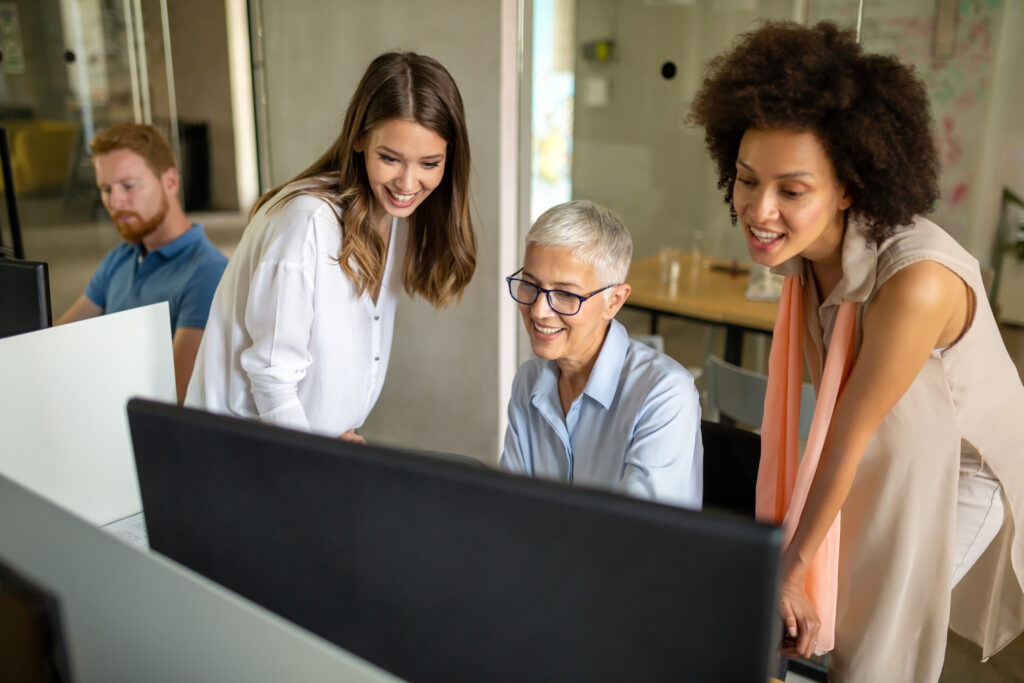 Group of programmers working in a software developing company office