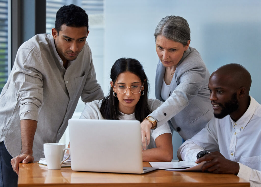 Shot of diverse group of businesspeople having a quick meeting in an office.