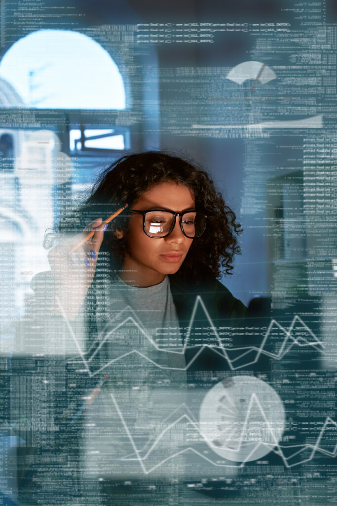 Young woman is analyzing statistics on a computer screen